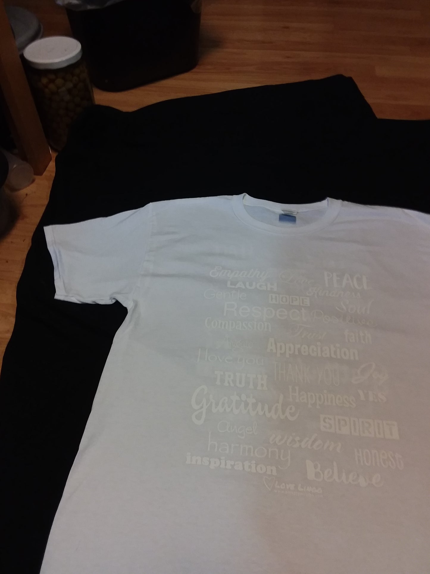 White positive message tee with white printing, very unique