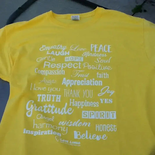 Flat-lay display of consciously crafted, energetically cleansed Love Lingo positive apparel designed to broadcast positive affirmations to the body.