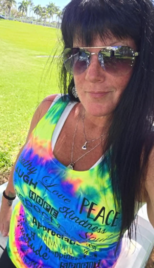 Close up of conscious clothing featuring high-vibe affirmations designed to interact with the body's energetic field.