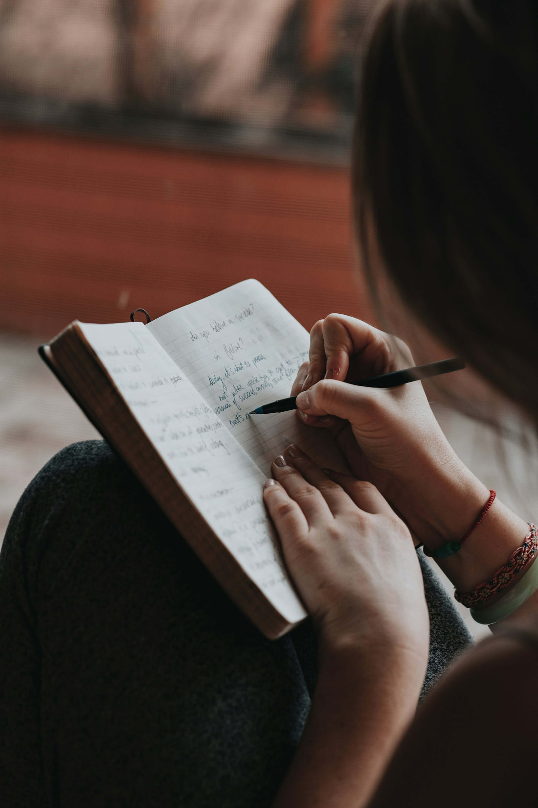 person reflecting and journaling